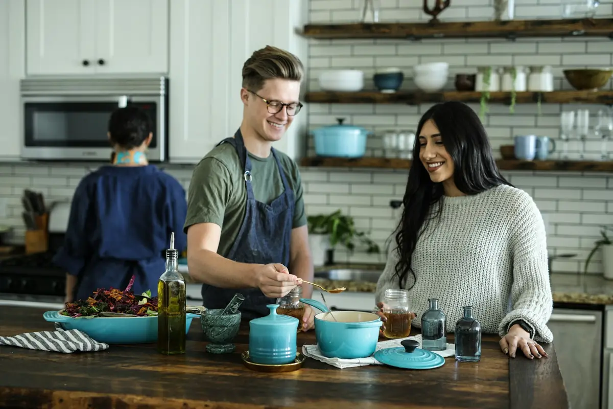 Friends cooking together in a kitchen